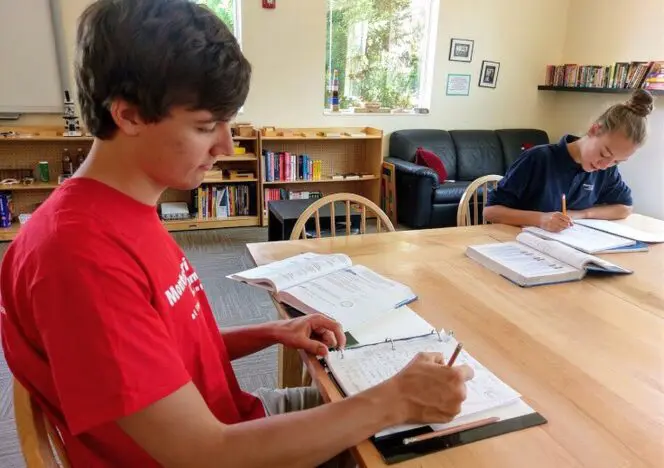 Children engaging in sensory activities using practical life materials.