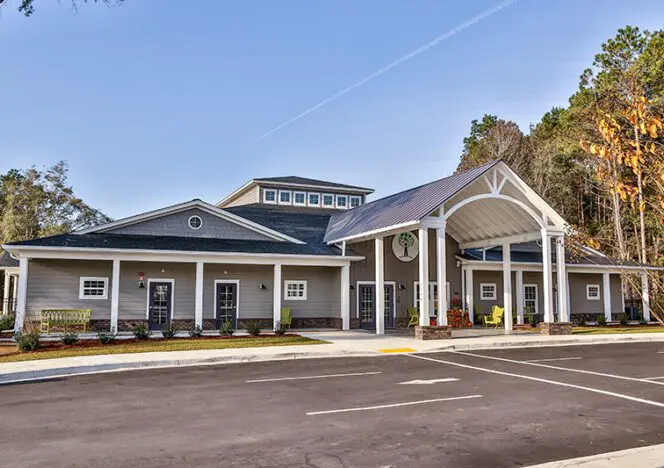 Teacher providing gentle guidance while students choose their own activities.