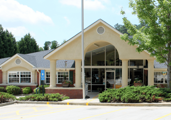 Children engaging in sensory activities using practical life materials.