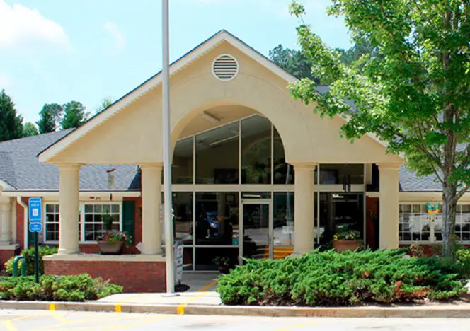 Children concentrating on self-chosen tasks, developing autonomy and focus.