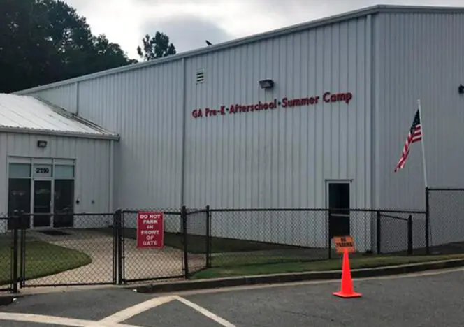 Classroom with Montessori learning materials organized on accessible shelves for student use.