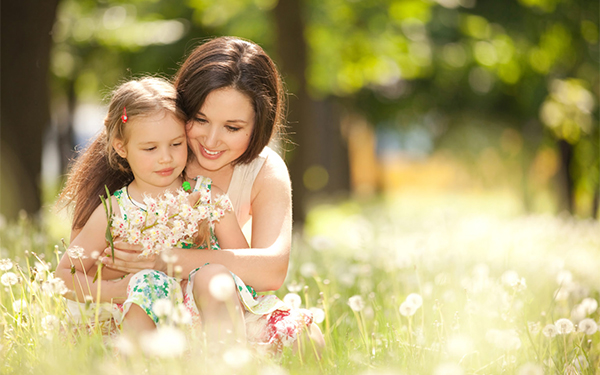 Girl And Mom In Garden