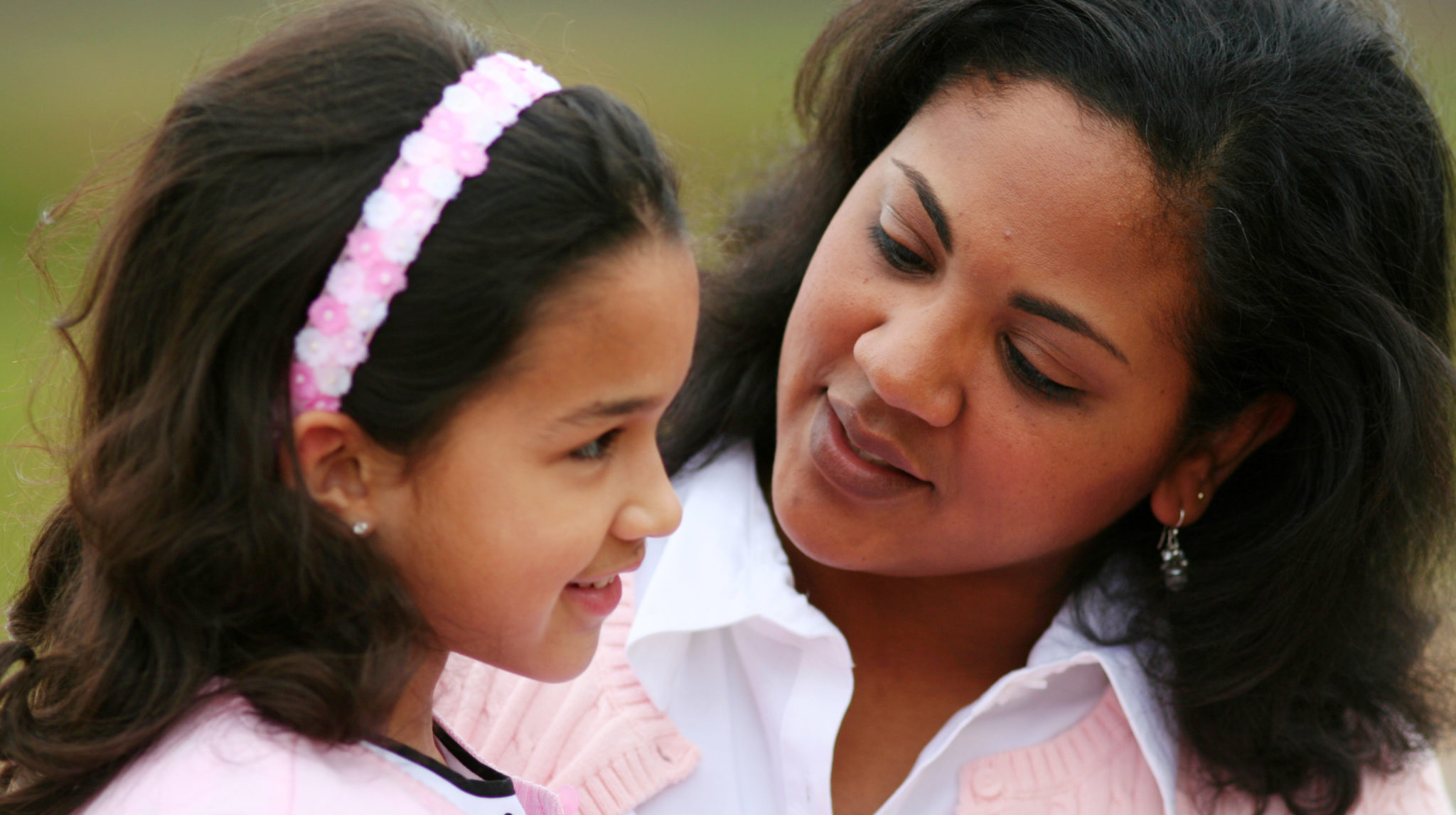 Mother and daughter together laughing while talking